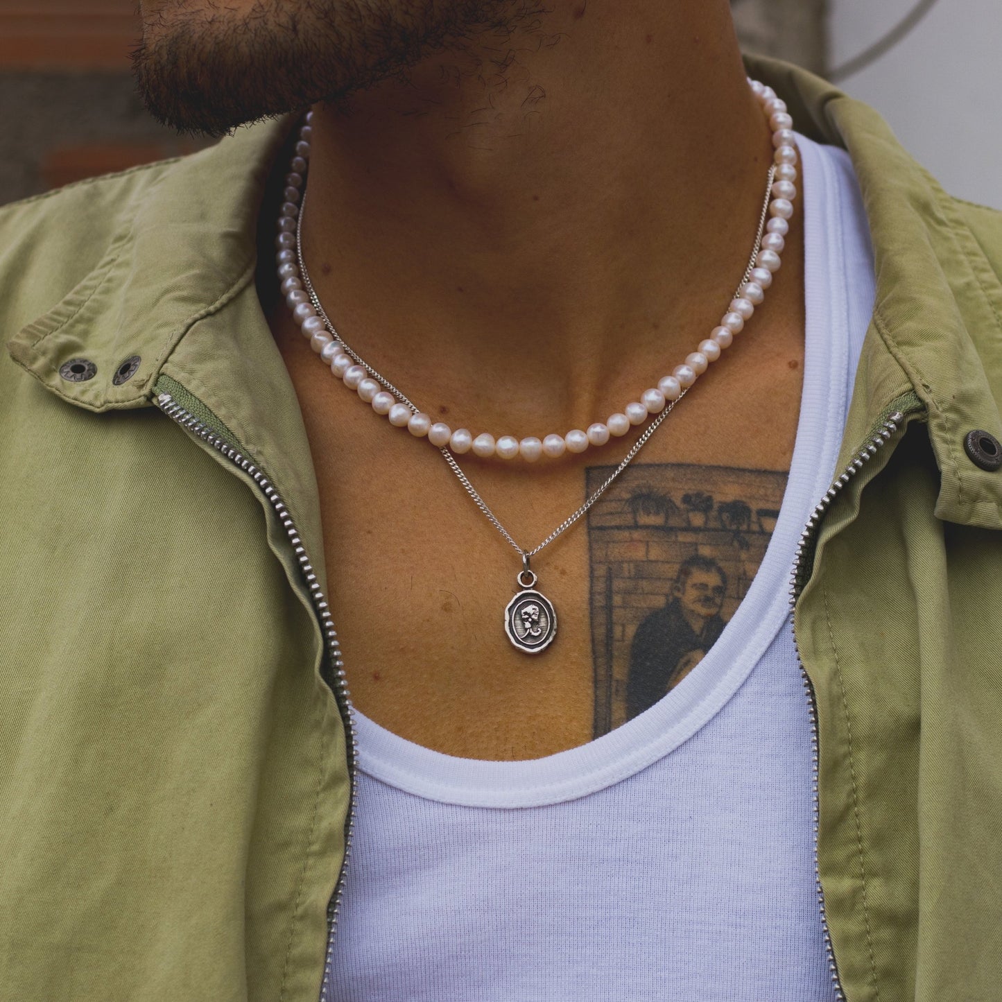 Collar ajustable de Perlas de Río con broche de elefante en plata 950.